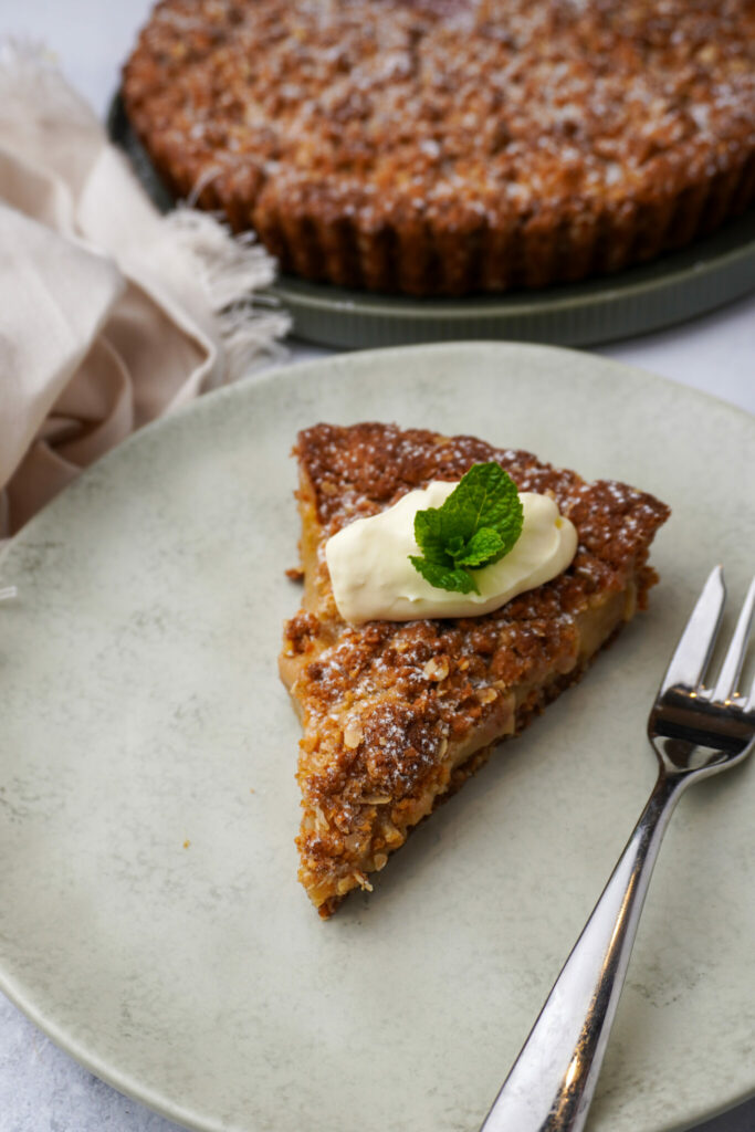 A chewy Anzac tart shell filled with oozy soft caramel